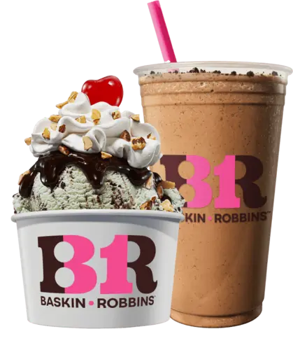 Baskin-Robbins mint chocolate chip sundae topped with whipped cream and cherry beside a chocolate milkshake with a pink straw.